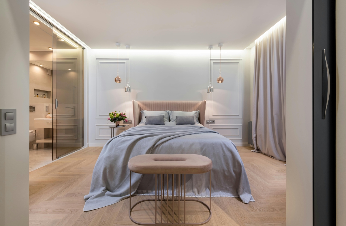 Soft neutral bedroom with pendant lighting